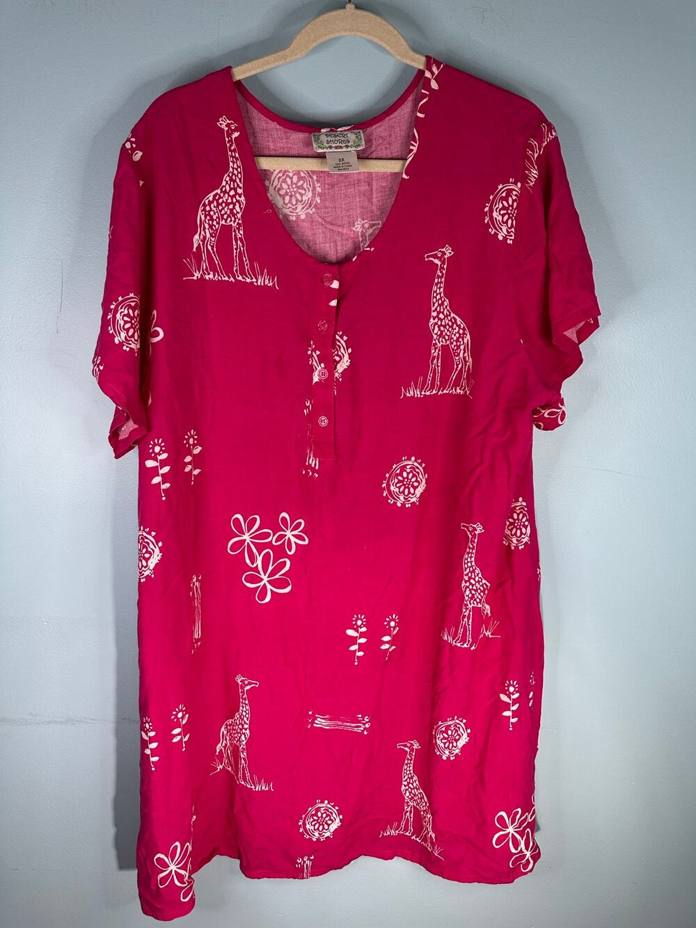 Desert Shores vibrant pink tunic dress featuring a white giraffe and floral 2X
